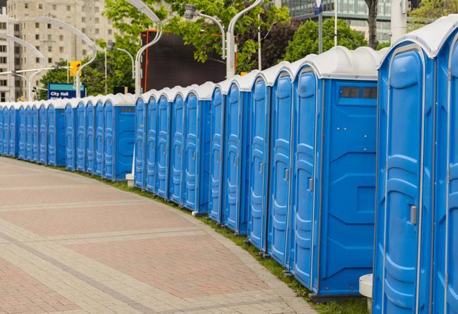 hygienic portable restrooms lined up at a beach party, ensuring guests have access to the necessary facilities while enjoying the sun and sand in Alhambra